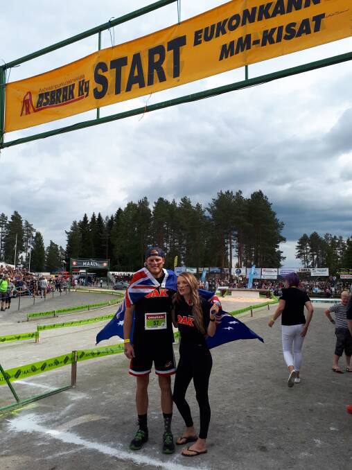 Adam and Tylee flying the Australian flag in Finland at the weekend. Picture: Supplied