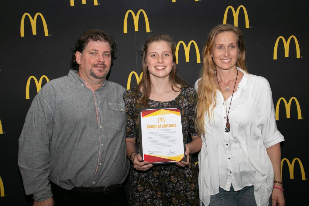 GRADUATION: Matilda Gibson pictured with mum Amanda and dad Nathan after the ceremony at the McDonald's Hamburger University campus in Sydney. Picture: Supplied