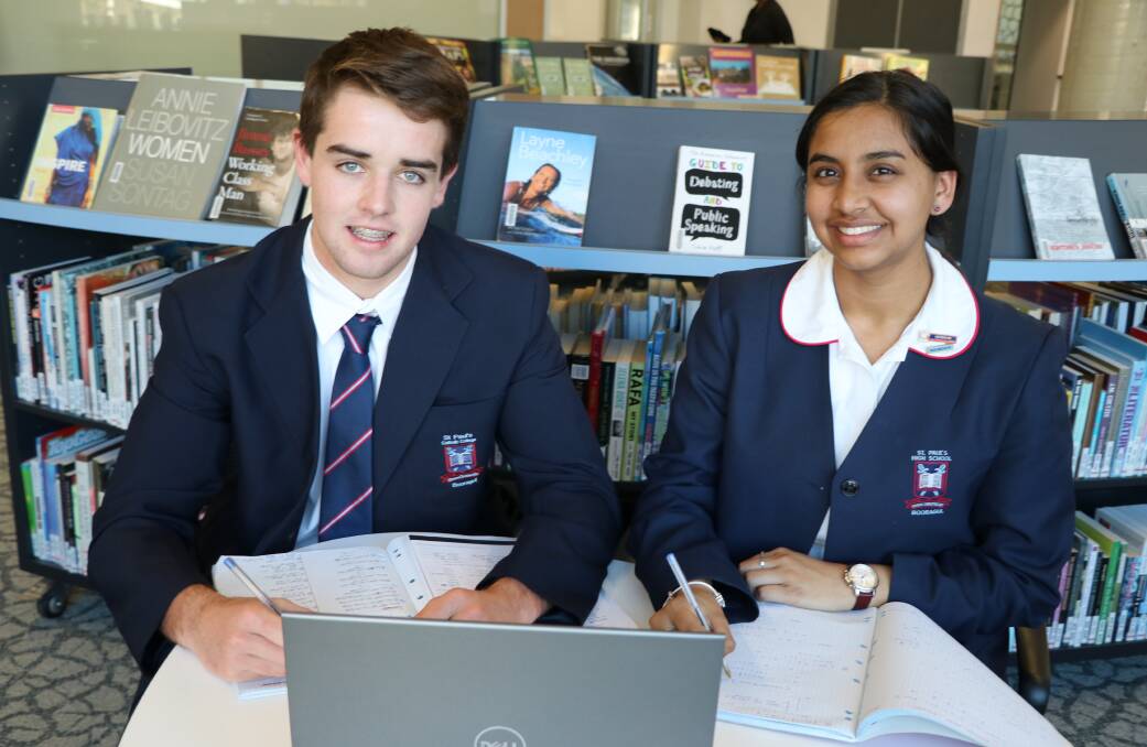 INFORMATION NIGHT: Year 11 students Thomas Hall and Shaila Dube studying at St Paul's Catholic College, in Booragul. Picture: Supplied