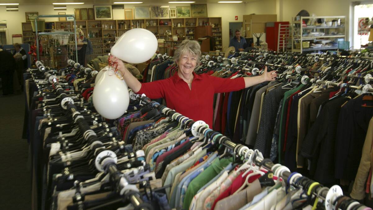FASHIONS: Manager Margaret Seguin pictured at the opening of the Salvation Army Family Store, at Bonnells Bay, in 2013. It offers a stack of secondhand fashion items, some of which will be showcased at the fashion parade on Saturday. Picture: David Stewart