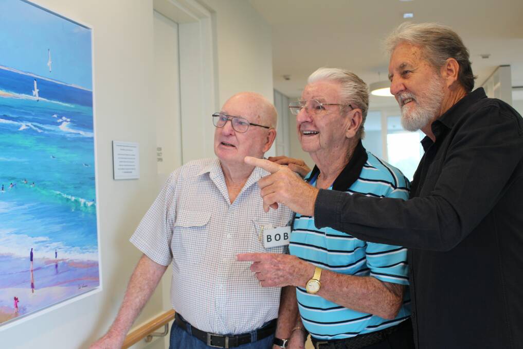 REMEMBER WHEN: Artist Paul Andrews, right, with Kilpatrick Court day program participants Ken Tredennick and Bob Crowe who were reminiscing aboput old times spent at Newcastle Beach. Picture: Supplied