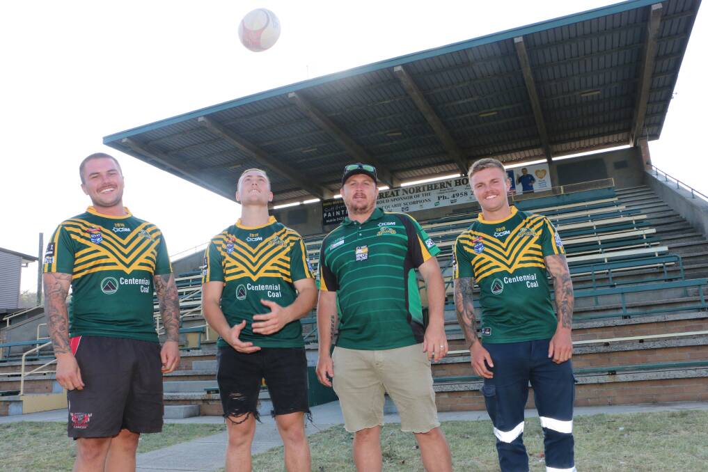 FRESH START: New Macquarie Scorpions coach Steve Kidd flanked by, from left, recruits Justin Afflick, Matt Moon and Jacob Afflick at Lyall Peacock Field this week. Picture: David Stewart 