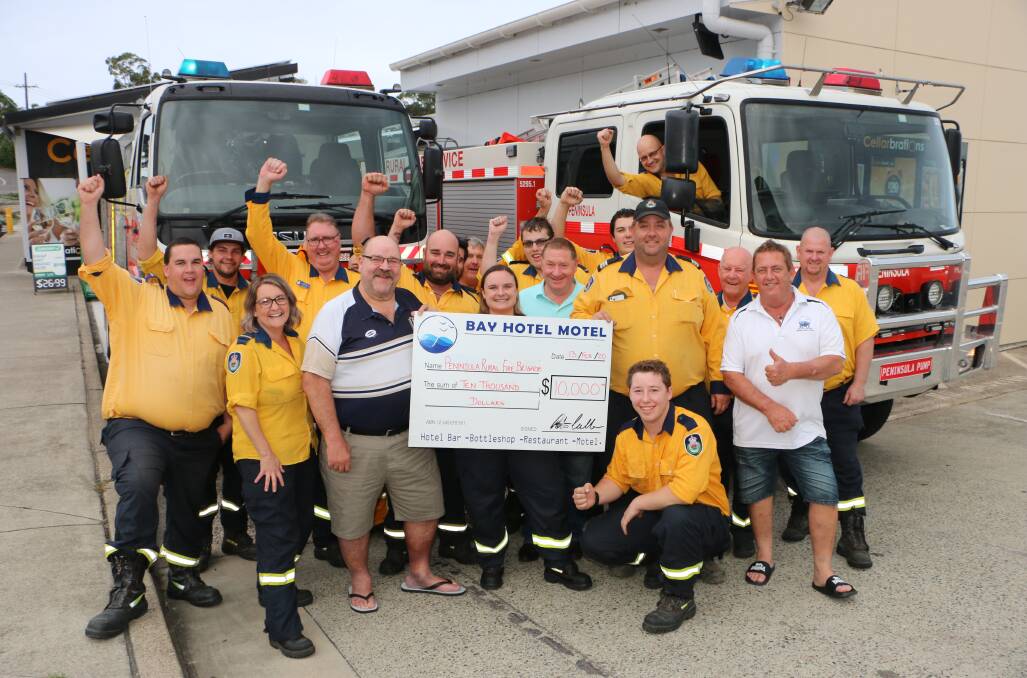 YOU BEAUTY: Peninsula Rural Fire Brigade members celebrate their $10,000 windfall with Bay Hotel Motel publican Peter Cullen and patron Bruce Clark on Thursday. Picture: David Stewart