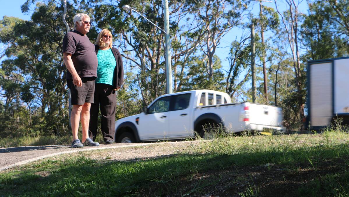 SAFETY ZONE: John and Cherylanne Auston are relieved that the break-down lane at the front of their Macquarie Street home in Morisset will be retained under revised plans released by the RMS. Picture: David Stewart