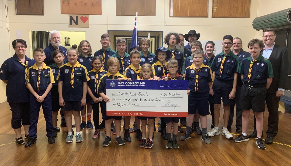 FEDERAL FUNDS: Pat Conroy presenting the Charlestown Scout Group with a Shortland Stronger Communities Grant of $6,660 to upgrade their kitchen. Picture: Supplied