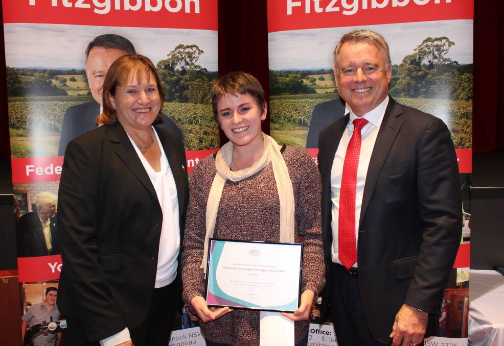 YOUNG ACHIEVER: Eleni Comino of Morisset Rotary Club, centre, with Singleton mayor Sue Moore, and Hunter MP Joel Fitzgibbon at the Hunter Volunteer Award presentation in Cessnock. Picture: Supplied