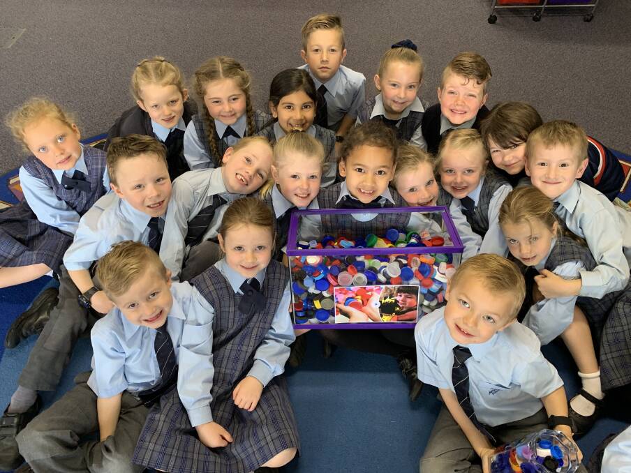 VALUED HAUL: Kindergarten children at Avondale School with a sample of the plastic bottle tops they've saved from going to landfill. Picture: Supplied