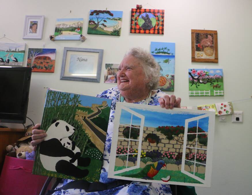 NEW SKILLS: Gloria Alexander with a sample of the artworks she's created since taking up painting at Avondale House, at Cooranbong. Picture: David Stewart