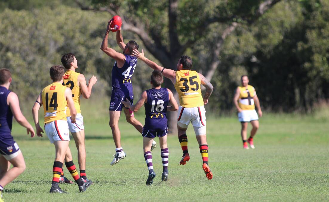 IT'S A MARK: Shane Frederickson takes possession for Lake Macquarie Dockers in the Black Diamond Australian football match against Maitland this year. Picture: David Stewart