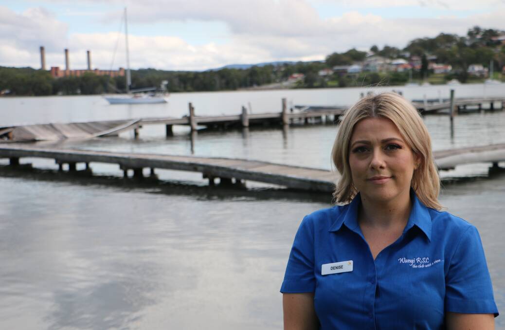 WAY FORWARD: Wangi RSL Club's Denise Dover at the dilapidated timber jetty that had been the lifeblood of the town. Council intends to have a new, bigger and better structure built and operational by next summer. Picture: David Stewart