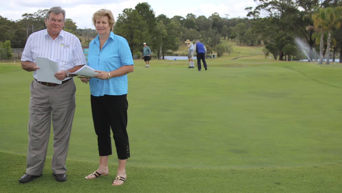 Morisset Country Club board president Erica Ford with former club CEO Ian Taylor on the course in 2013. Picture: David Stewart