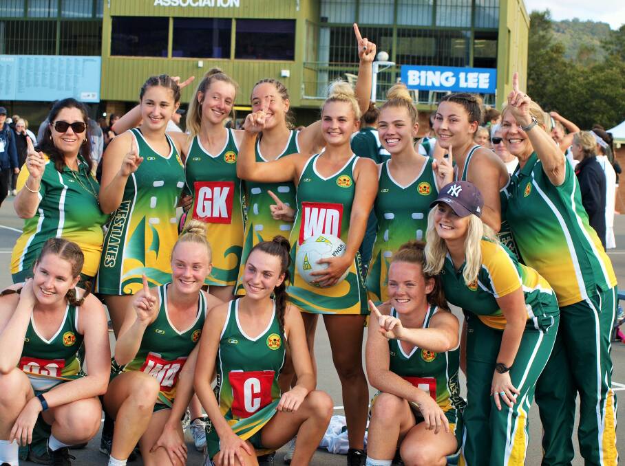 STATE CHAMPS: The Westlakes opens team and support staff celebrate their Division 2 win in Gosford. Picture: Kym Culbert