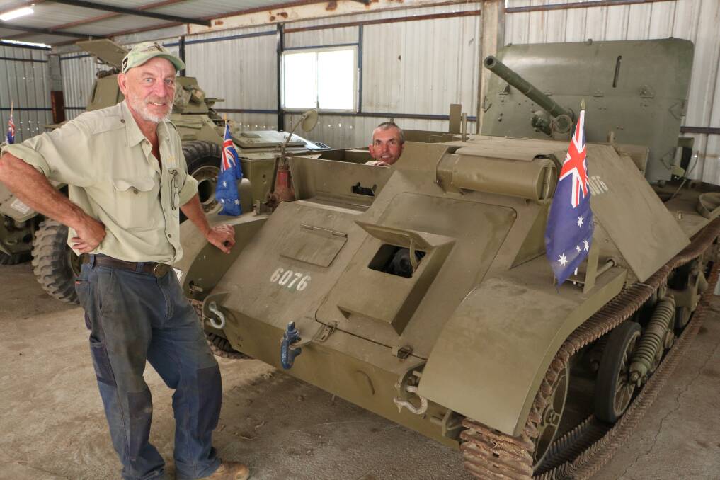 OUR HISTORY: Tracy Vadnjal, left, and Jason Becker, with an Australian tank used for training troops in Darwin for World War II. Picture: David Stewart