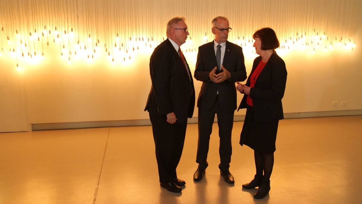 ON SHOW: Arts Minister Don Harwin, left, with Greg Piper and mayor Kay Fraser at Lake Macquarie City Art Gallery. Picture: Supplied.