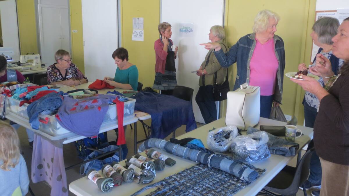 VALUABLE SKILLS: Participants learned how to repair garments - not throw them away - at the inaugural repair cafe in Toronto. The next one is being planned. Picture: Supplied