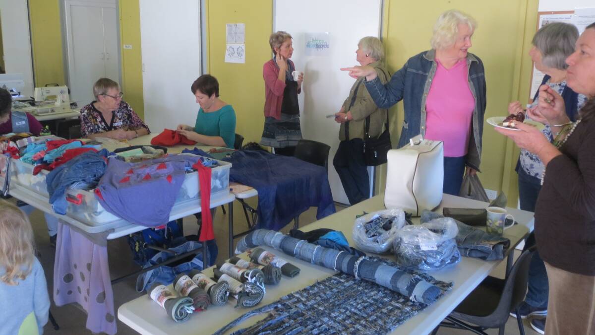 VALUABLE SKILLS: Participants learned how to repair garments - not throw them away - at the inaugural repair cafe in Toronto. The next one is being planned. Picture: Supplied