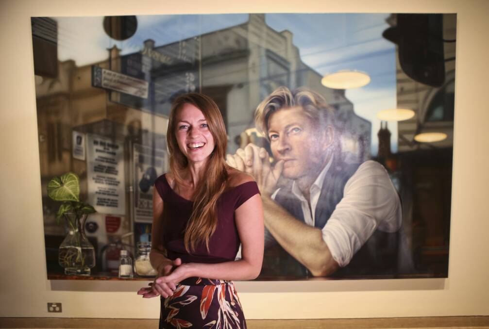 HYPER-REAL: Winner of the 2019 Archibald Packing Room Prize, artist Tessa MacKay, with her portrait of actor David Wenham, entitled 'Through the Looking Glass'. Picture: James Alcock.
