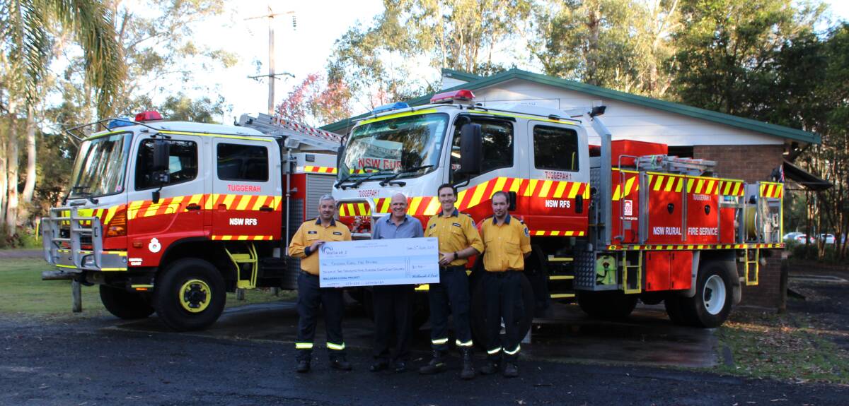 COOL RELIEF: Wyong Coal general manager Peter Allonby presents the Wallarah 2 Community Foundation cheque to Tuggerah Rural Fire Service Brigade. Picture: Supplied