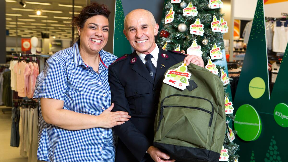 GIFT APPEAL: Kmart's Kate Thiedman with the Salvation Army's Peter Ellis. Locals are invited to leave a gift at the express drop-off point located at the front of the Kmart Lake Haven store. Gifts do not need to be purchased at Kmart, nor do they need to be wrapped. Picture: Supplied