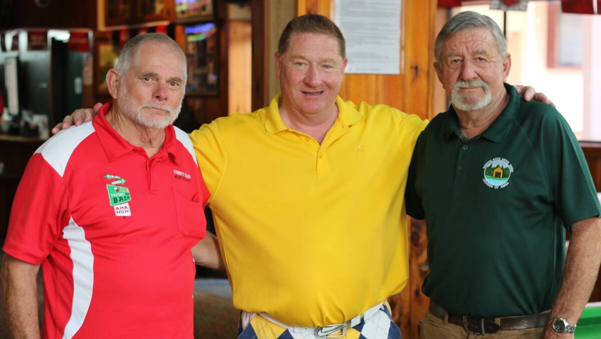 JOB DONE: From left, Reg Ryan, Peter Cullen and John Mulcahy at the Bay Hotel, Bonnells Bay, for a fundraiser in 2016. Picture: David Stewart