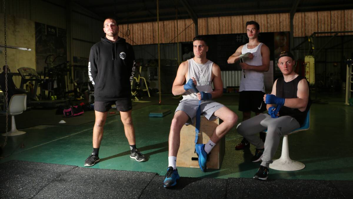 FIT AND READY: Boxers, from left, Joe Ling, 20, of Toronto, Tristan Maskell, 21, of Bonnells Bay, Max Ward, 17, of Morisset, and Lachlan Pennell, 19, of Awaba, before training at Team Machine Boxing Club. Picture: David Stewart