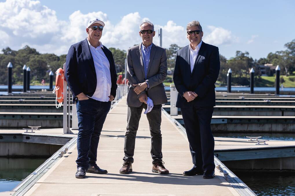 NOW OPEN: Johnson Property Group's Keith Johnson, left, with MP Greg Piper, centre, and Lake Macquarie City Council's deputy CEO Tony Farrell. Picture: Supplied