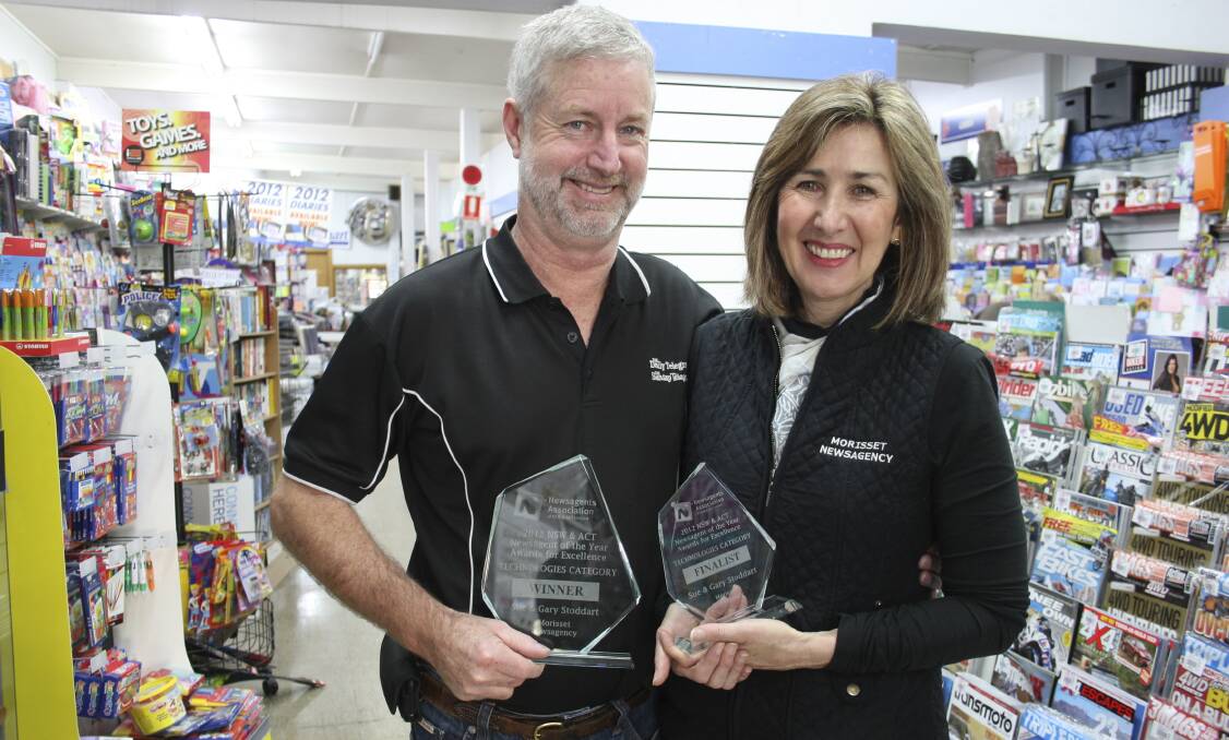 Gary and Sue Stoddart are the former owners of Morisset Newsagency. They are pictured here in 2012 with trophies received at the NSW and ACT Newsagents Association Awards. Picture: David Stewart