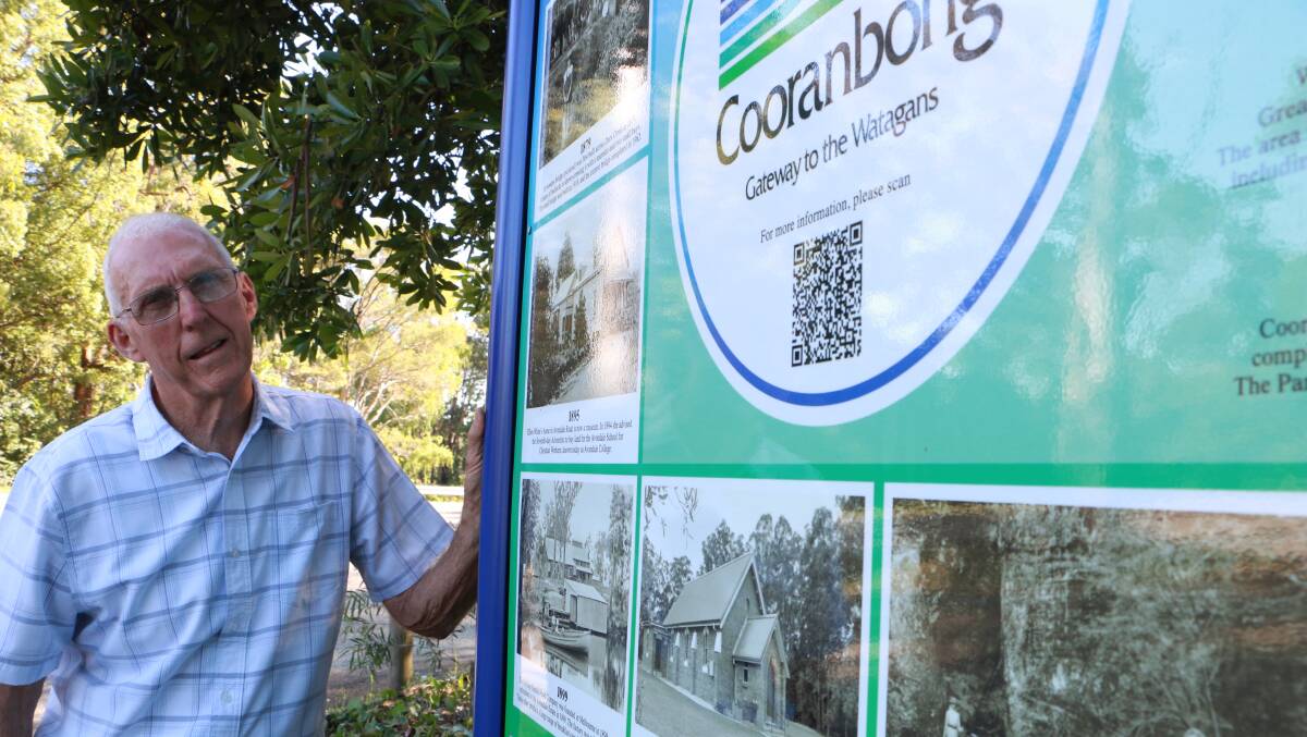 POINTS OF INTEREST: Alliance treasurer Ray Boehm with the newly installed board featuring images and information panels on Cooranbong's history. Picture: David Stewart