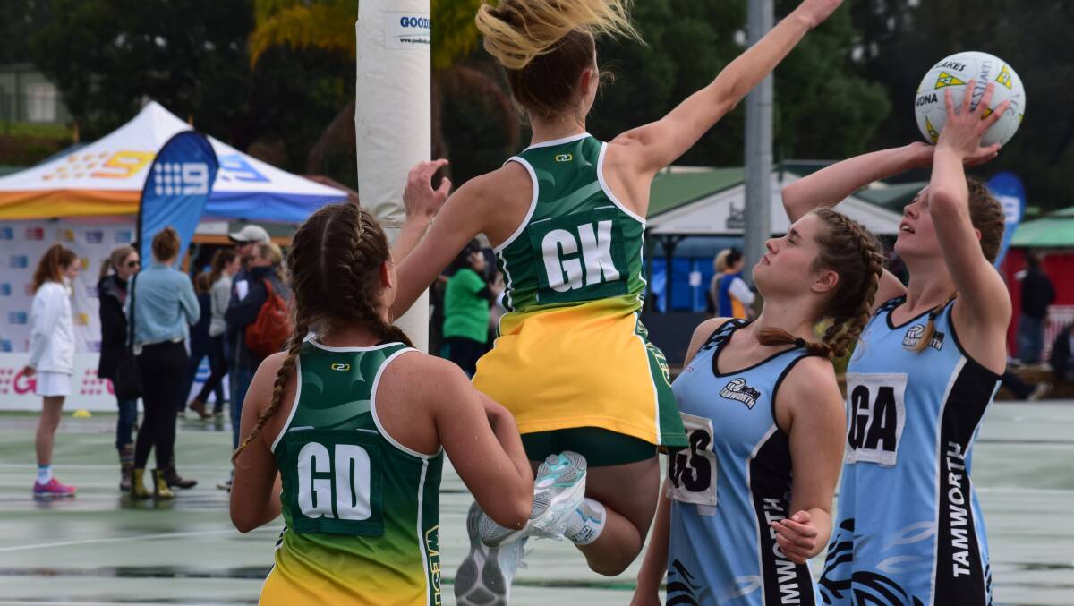 BIG EFFORT: Khiara Jones, left, and Tiana Baldock competing for Westlakes against Bathurst at the NSW Netball Championships at the weekend. Picture: Supplied
