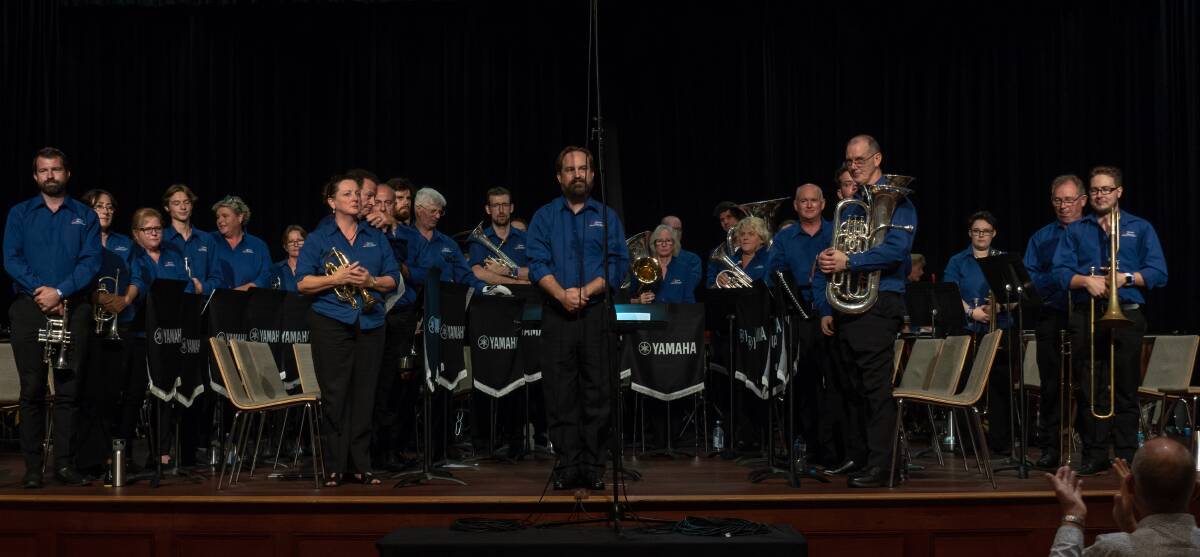 TAKE A BOW: Toronto Brass rises to the applause after performing at the Australian Band Championships, in Brisbane, at Easter. They finished third overall in B Grade. Picture: Supplied
