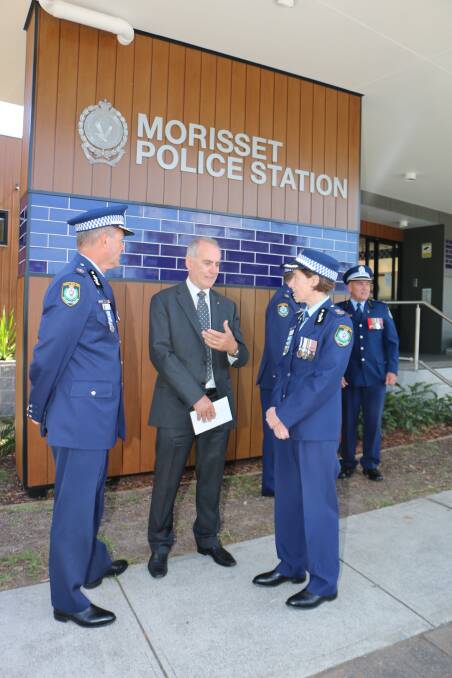 CAMPAIGN: Member for Lake Macquarie Greg Piper, centre, chats with police deputy commissioner Cath Burn and assistant commissioner Max Mitchell at the official opening of Morisset Police Station in 2016. Picture: David Stewart