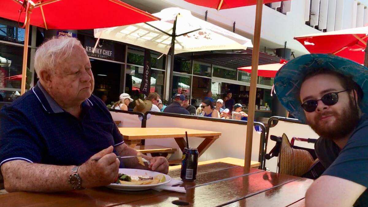BEATS TV: Neville Tosen enjoys lunch at the Sydney Cricket Ground with his Home Care carer Mitchell Knight during the Australia v England one-dayer. Picture: Supplied