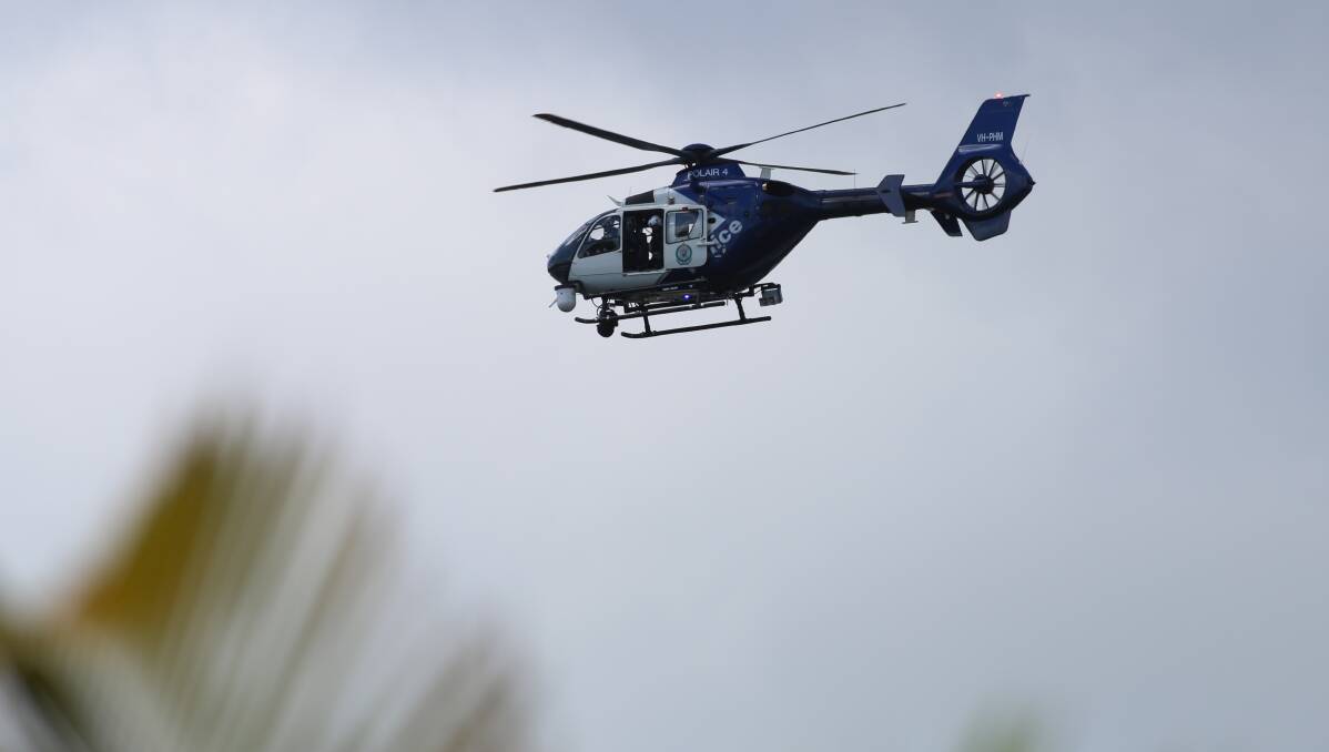 POLAIR 4: A police helicopter searching the Buff Point area this morning for missing Budgewoi woman Rosemary Bowyer, 80. Picture: David Stewart