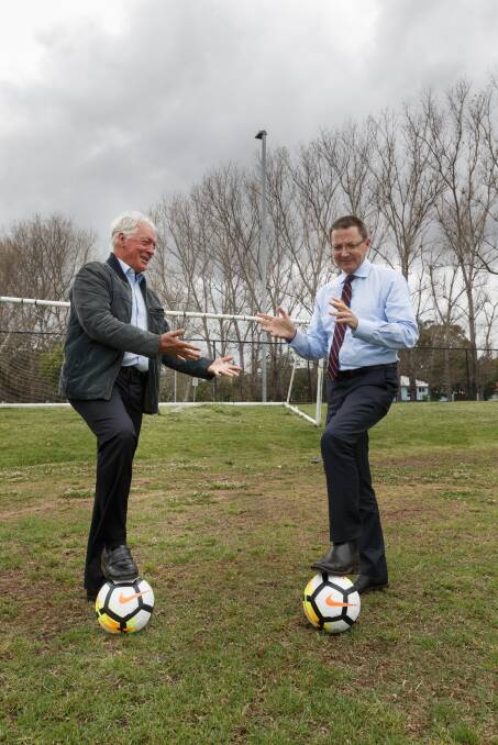 PLAY ON: Northern NSW Football chairman Bill Walker, left, and NSW Parliamentary Secretary for the Hunter, Scot MacDonald, at Lake Macquarie Regional Football Facility on Thursday. Picture: Max Mason-Hubers 