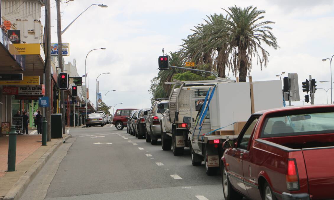 WAIT ON: In the report, the RMS notes the proposed Warnervale Link Road would need to be completed after the proposed
Pacific Highway upgrade through the Wyong town centre (pictured)
to avoid increasing traffic congestion. Picture: David Stewart