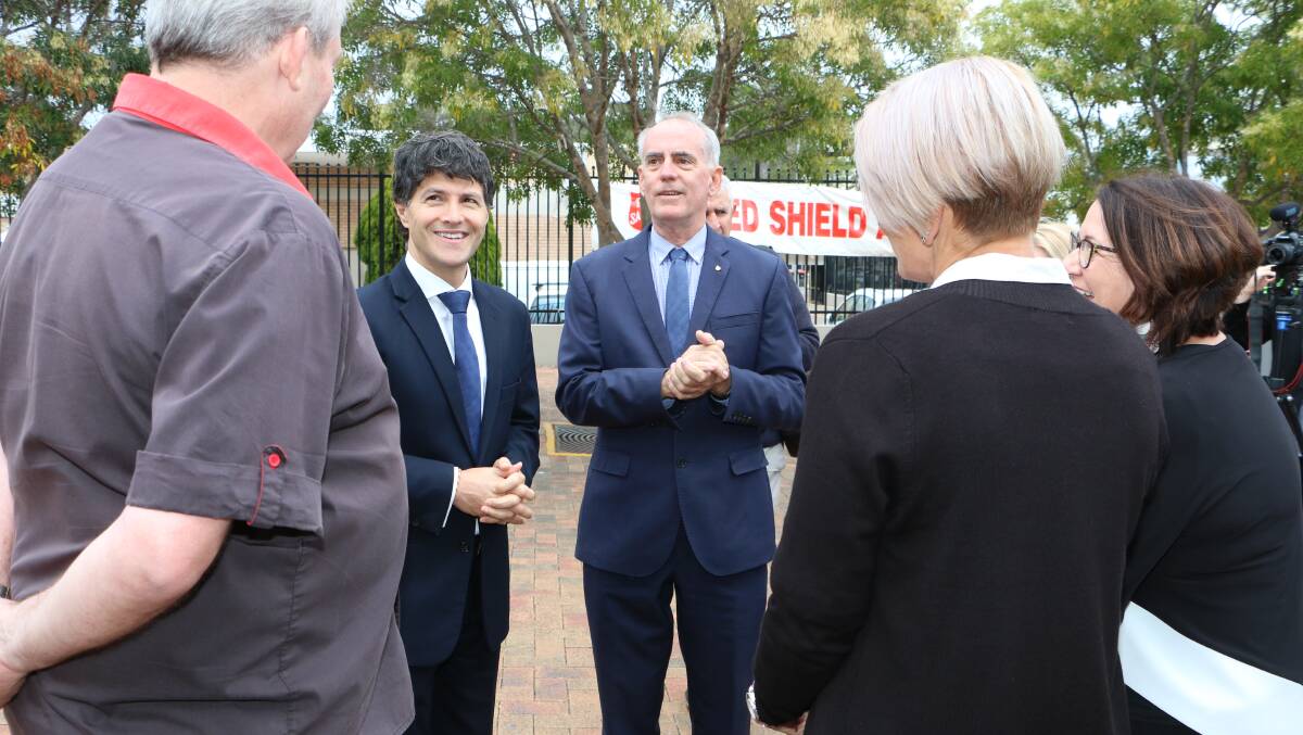 COMING SOON: Victor Dominello, left, and Lake Macquarie MP Greg Piper talk to locals about the Service NSW Centre which will open in Toronto next year. Picture: David Stewart