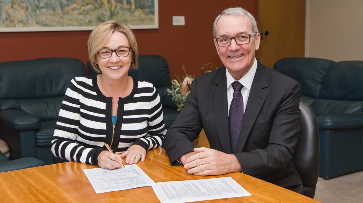 RESIGNED: Brian Bell, pictured with former Lake Macquarie City mayor Jodie Harrison. Picture: Supplied