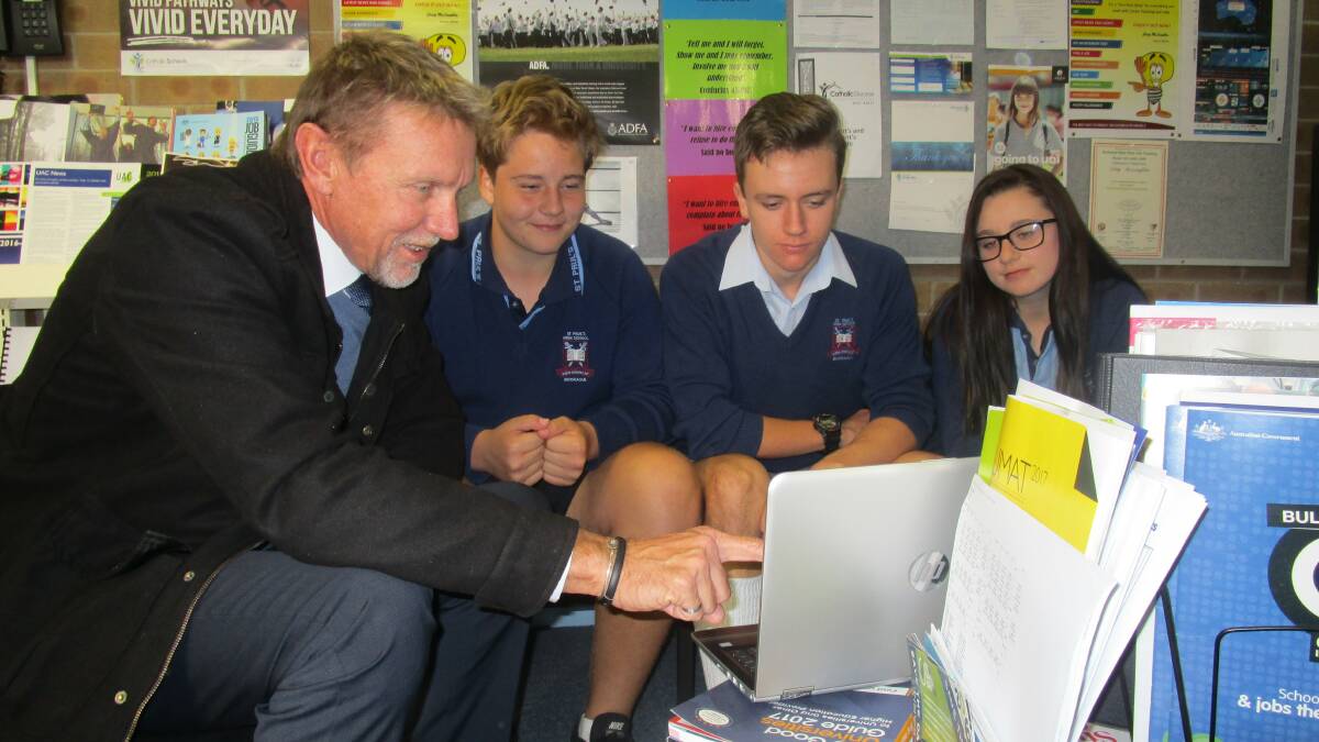 BIG DECISIONS: Careers advisor Craig McLoughlin with St Paul's High School students, from left, Ethan Hure, Curtis Matthews and Layken Portelli researching vocational pathways and career options. Picture: Supplied