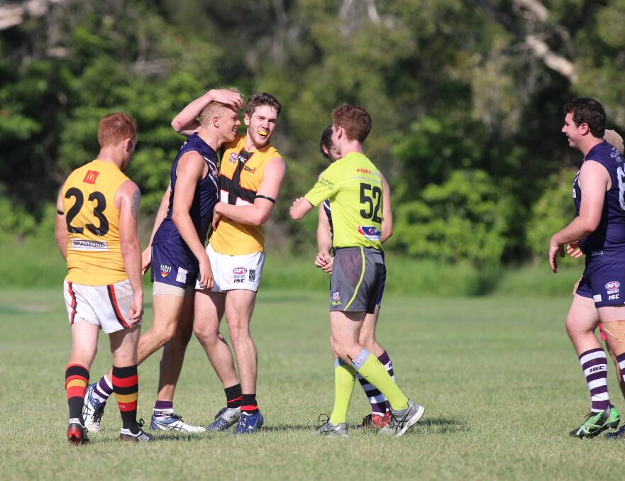 JUST FOOLING: Maitland's Harrison Harbrow, right, gets up close and personal with Lake Macquarie's Damon Tually on Saturday. Picture: David Stewart