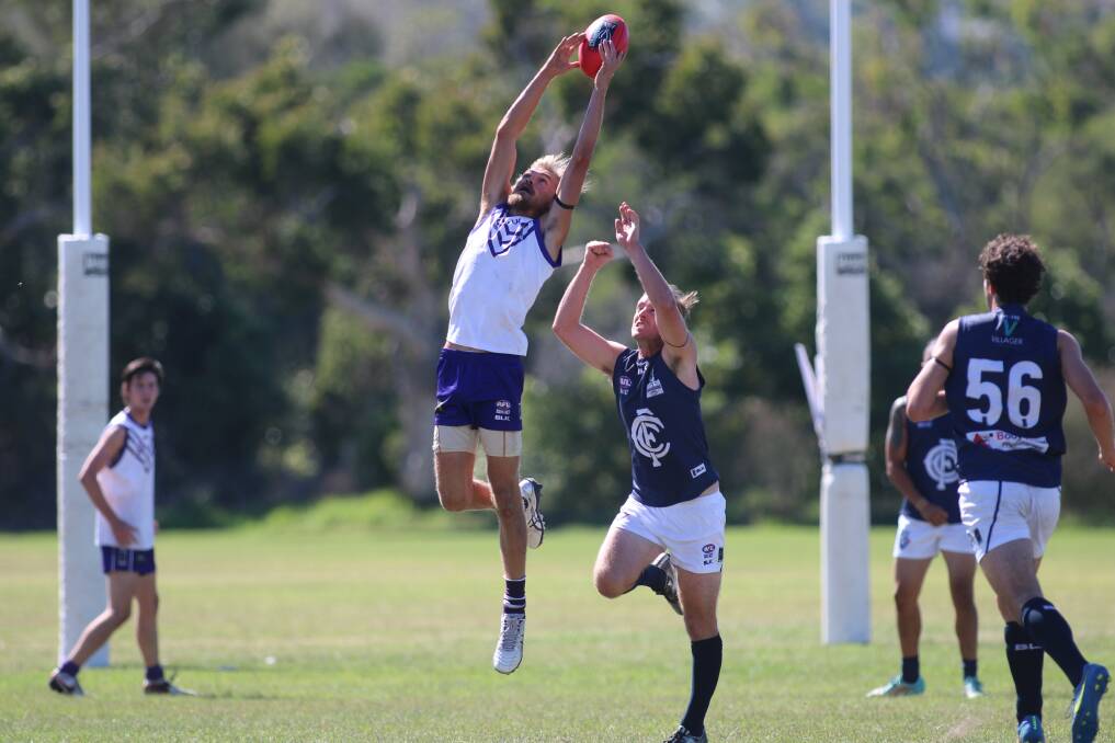 THEY'RE BACK: Lake Macquarie Dockers' Daniel Zuzac goes up for a mark at Teralba in the First Division competition in season 2016. The Dockers return to the Black Diamond Cup this season. Picture: David Stewart