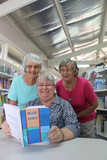 GOOD READ: Chris Langshaw, front, with fellow Blue Room Poets Jeanette Campbell, left, and Jill Overton, at Wangi Wangi Library. Picture: David Stewart