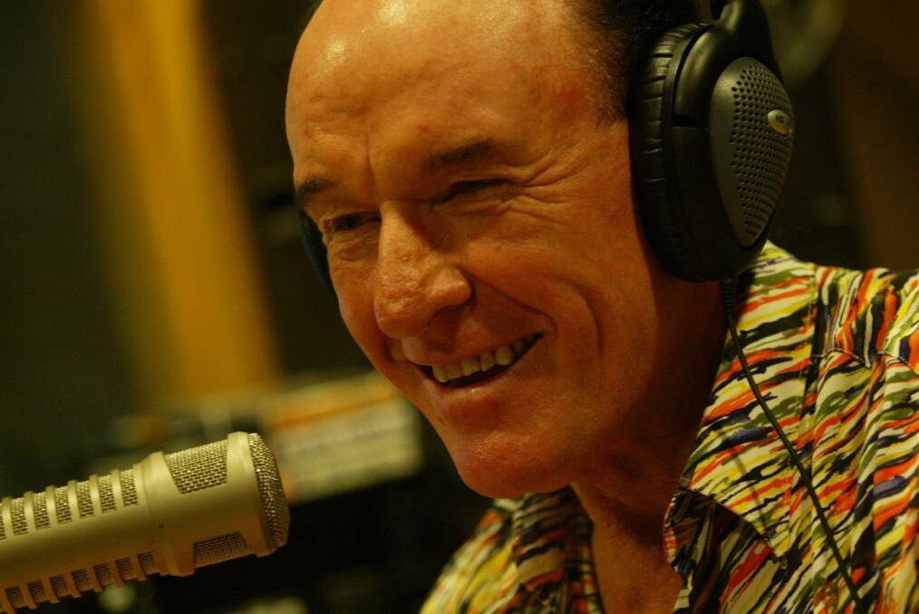 LOCAL FAVOURITE: Carter Edwards, of Canton Beach, has been making people smile for decades. He's pictured at the microphone in 2006. Picture: Supplied
