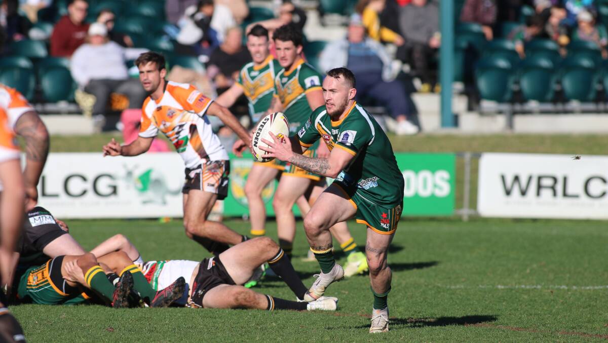 SPEED MAN: Wyong's Luke Sharpe takes off into space following an offload. Picture: David Stewart