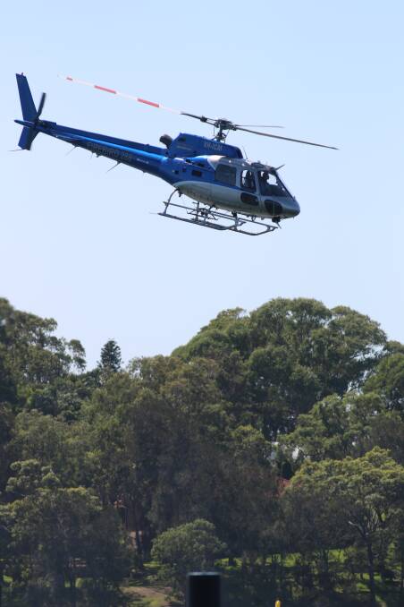 IN DISPUTE: The helicopter used during acoustic testing at the Trinity Point marina site, at Morisset Park, in 2016. Picture: David Stewart