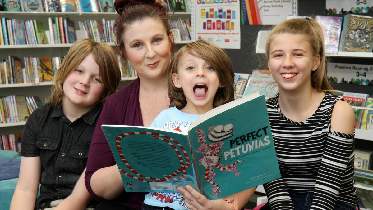 FAMILY TIME: The Boughey family, at Speers Point Library. From left, Cameryn, 10, mum Amanda, Lincoln, 4, and Isabella, 13. Picture: Supplied.