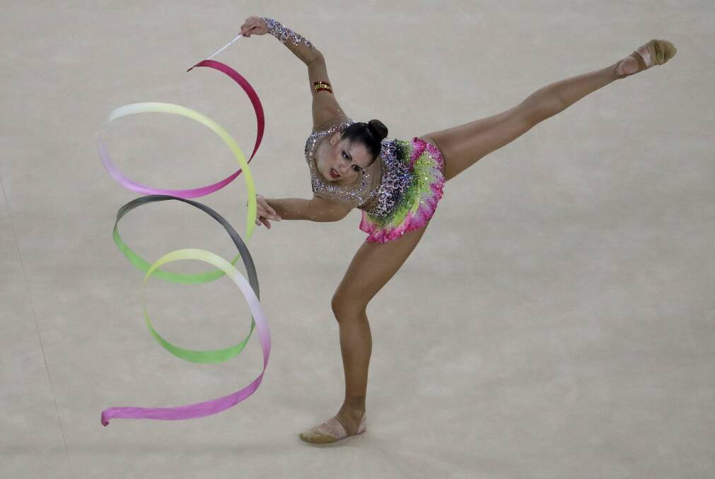 DISCIPLINE: Spain's Carolina Rodriguez performs during the rhythmic gymnastics qualifications at the Rio Olympics in 2016. Picture: AP Photo/Julio Cortez.