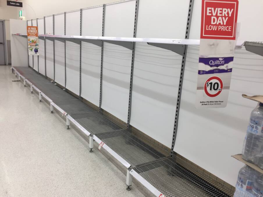 CLEANED OUT: The toilet paper shelves were bare at Coles Morisset on Thursday afternoon. It's been a similar story in all supermarkets in the district, and in many areas around the nation. Picture: David Stewart