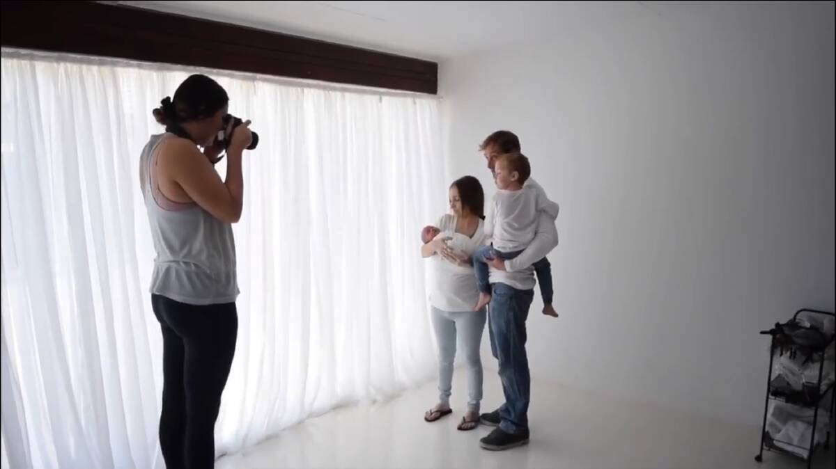 Melissa McLean photographing a family in her Cooranbong studio. Picture: Supplied