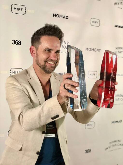 WINNING: Central Coast filmmaker Jason van Genderen with his two trophies from New York. Picture: Supplied
