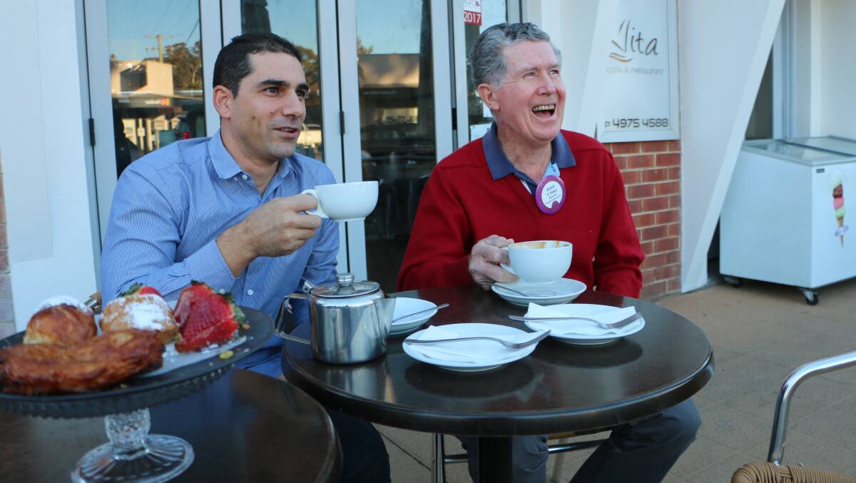 SATISFACTION: Simon Bertaglia, left, and Tony Prior, enjoy afternoon tea at Vita Cafe and Restaurant, in Wangi Wangi, as they reflect on Mr Prior's 50 years with Lions. Picture: David Stewart